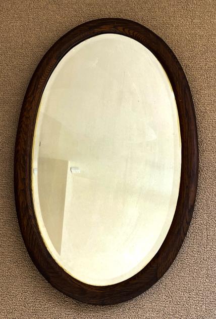Antique C 1900 American Oak Oval Wall Mirror: Antique C 1900 American Oak Oval Wall Mirror. Measures 16 x 26 inches.