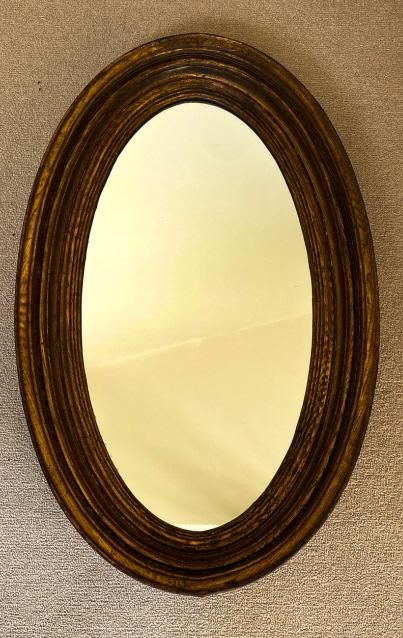 Antique Oval Form Carved Wood Wall Mirror: Antique Oval Form Carved Wood Wall Mirror. Measures 39.5 x 24 inches.