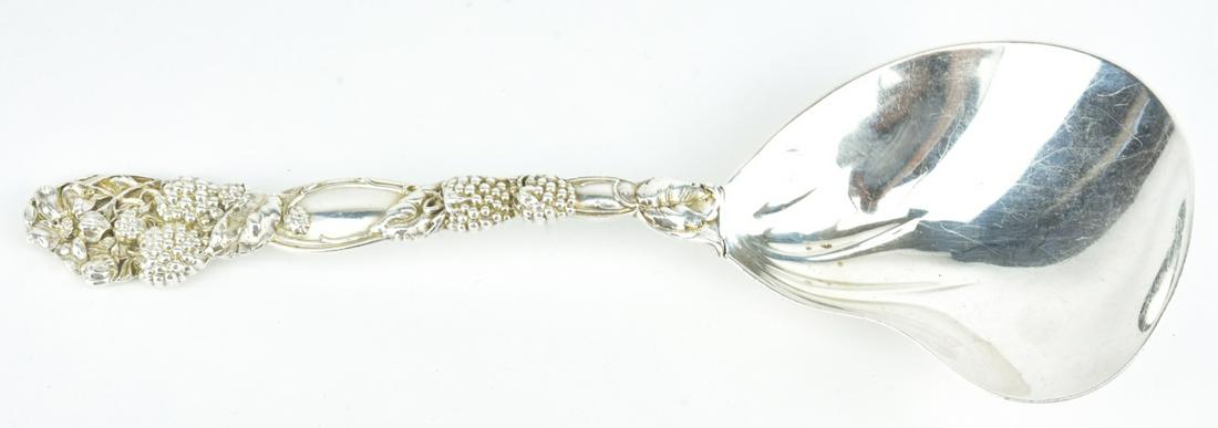 Tiffany & Co Makers Grape Motif Sterling Spoon: Tiffany & Co Makers Grape Motif Sterling Spoon. Hallmarked. Weighs approximately 125 grams. Measures 9.5 inches in length.
