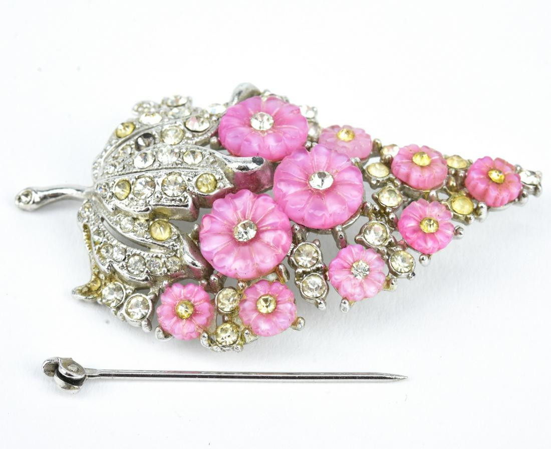Vintage Rhodium Plated Costume Jewelry Brooch: Vintage Rhodium Plated Costume Jewelry Floral Brooch. Clear paste and pink stones. Measures 2.5 inches in length.