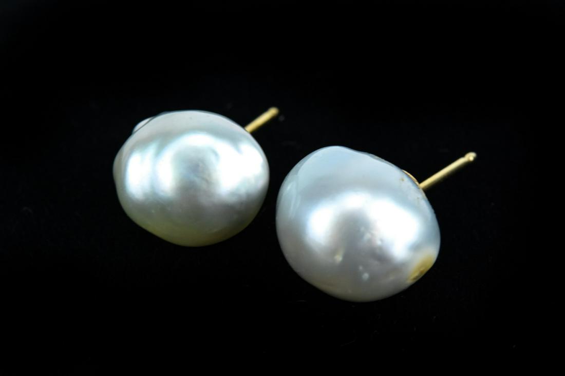 Pair 14k Yellow Gold & Culture Baroque Pearl Studs: Pair of 14kt Yellow Gold & Culture Baroque Pearl Studs. Set with 14kt yellow gold. Pearls are approximately 12 mm in width.