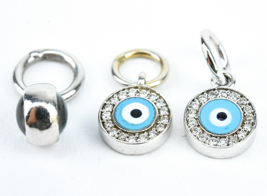 Aaron Basha 18k White Gold Diamond Evil Eye Charm: Aaron Basha 18k White Gold Diamond Evil Eye Charm Lot – Lot of 3 in 18k gold marked 750. Two signed Aaron Basha pendants with enamel and diamonds (one is faint). One is attributed but unsigned. Abou