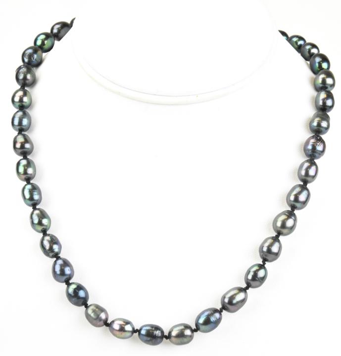 Baroque Tahitian Pearl Hand Knotted Necklace: Baroque Tahitian Pearl Hand Knotted Necklace. Hand knotted on silk thread. Baroque pearls with tones of grey, silver and black. Filigree clasps. Strand measures just over 18 inches in length.