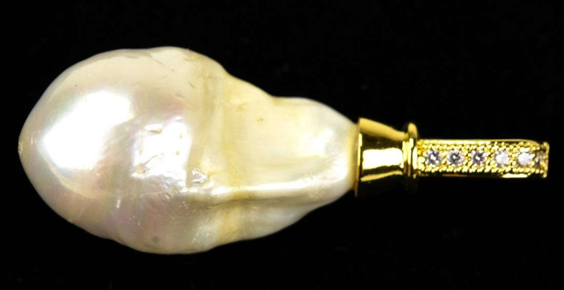 Large Cultured Baroque Pearl Necklace Pendant: Large Cultured Baroque Pearl Necklace Pendant. High luster baroque pearl of approximately 25 mm in length, pendant overall is nearly 1.75 inches in length.