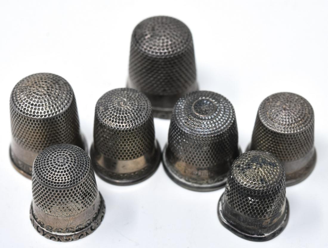 Collection Antique Sterling Silver Sewing Thimbles: Collection of Antique Sterling Silver Sewing Thimbles. Six of the seven are marked STERLING.