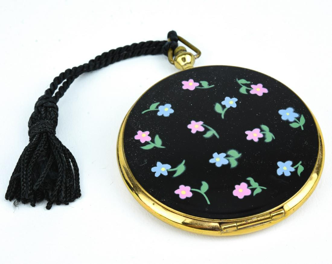 Vintage Enamel Locket Form Makeup Compact: Vintage Enamel Locket / Pocket Watch Form Makeup Compact. Enamel design with flowers on front. Measures 3 inches in length.