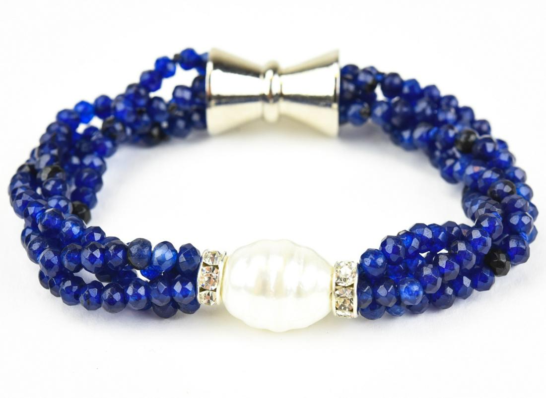 Four Strand 100 Carat Sapphire Bead Bracelet: Four Strand 100 Carat Sapphire Bead Bracelet w Baroque Pearl. Measures 8 inches in length. Beads test as sapphire on the Presidium, may be treated / enhanced. Having approximately 100 carats of sapphi