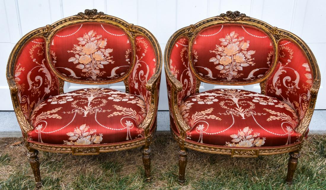 Pair French Country Louis XV Carved Bergere Chairs: Pair French Country Louis XV Carved Bergere Chairs. Upholstered in red and gold silk damask. 35 inches x 31 inches x 21 inches