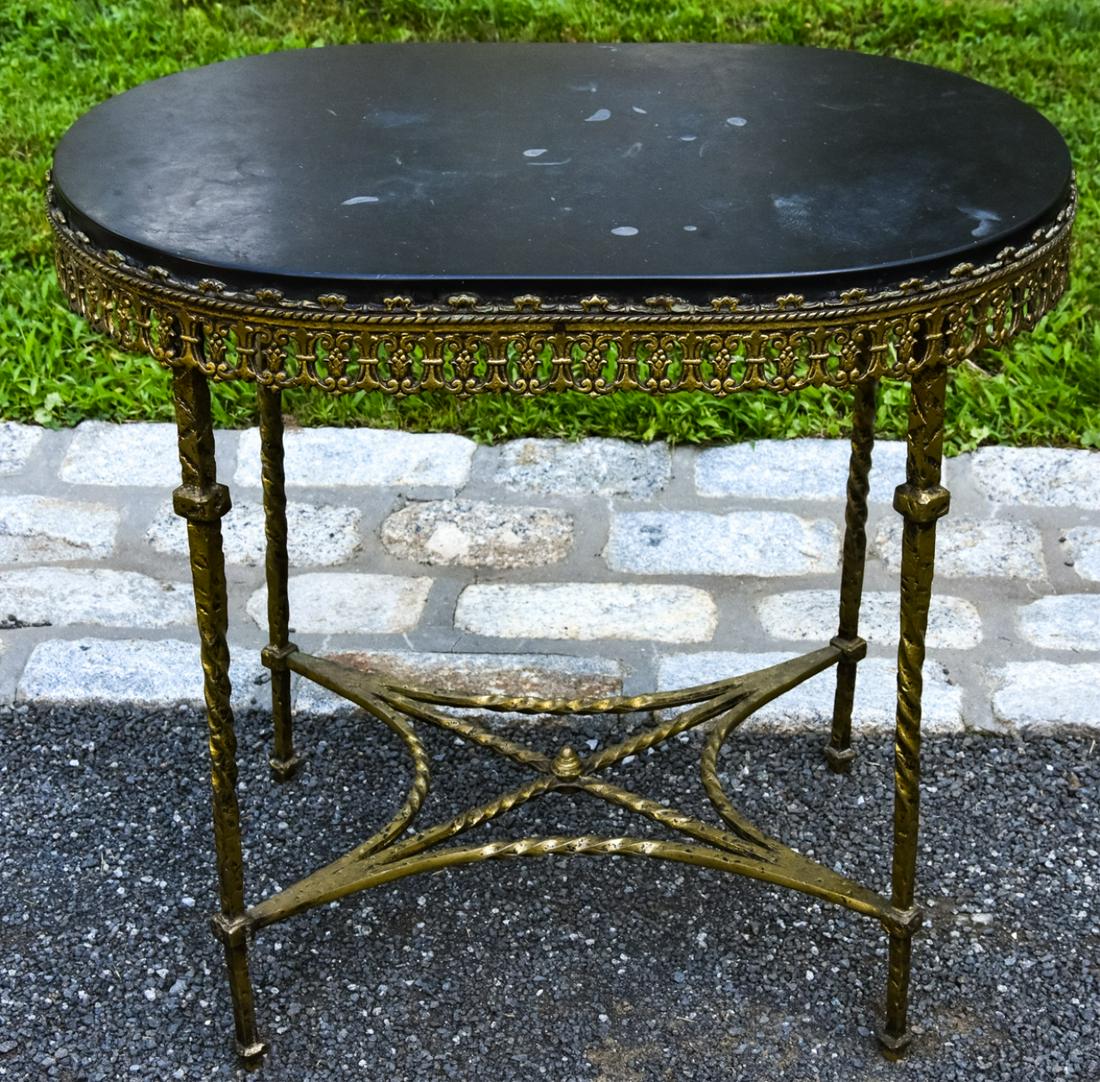 Hollywood Regency Ormolu and Marble Oval Table: Hollywood Regency Gilt Brass Ormolu and Marble Oval Table with Apron and Stretcher Base. 22 inches x 24 inches x 16 inches