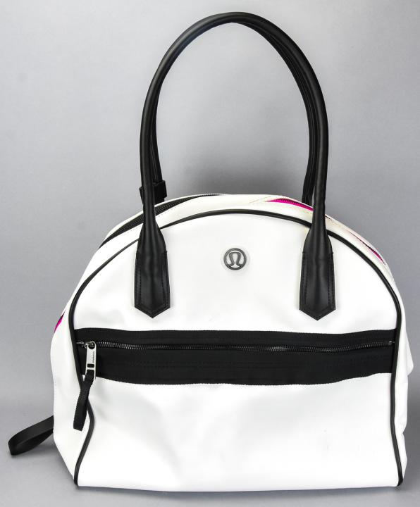 Lulu Lemon Satchel, Over Night, Gym, Yoga Bag: Lulu Lemon Vinyl Satchel, Over Night, Gym, Yoga Bag. White, black accents and pink lining. Multiple ample compartments. New condition. 24 inches x 19 inches