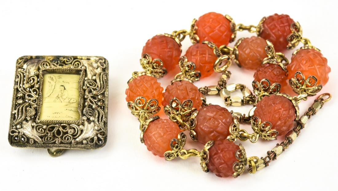 Antique Chinese Carved Carnelian & Bone Necklace: Antique Chinese Carved Carnelian & Bone Necklace. Carved carnelian bead necklace, painted bone plaque buckle. Necklace measures 15 inches in length.