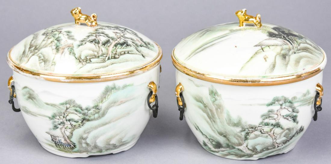 Pair Chinese Porcelain Jars with Foo Dogs: Pair Chinese Hand Painted Porcelain Jars with Foo Dogs. Gold Foo Dog finials, metal handles, and calligraphy inscriptions. Each measures 5.25 inches in diameter