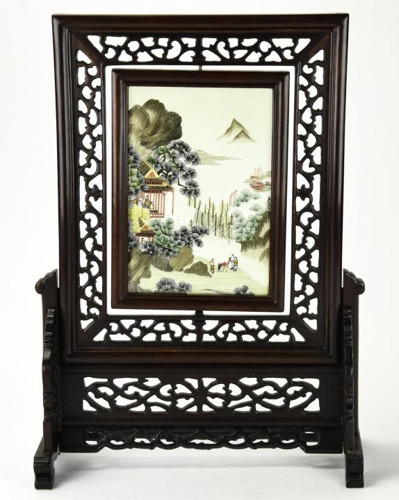 Chinese Carved Rosewood Rotating Silk Panel: Chinese Carved Rosewood Rotating Silk Panel / Table Screen. Chinese carved rosewood table screen with center rotating silk panel in glass. Measures 16 inches x 12.5 inches x 5 inches.