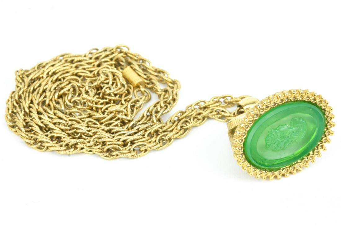 Vintage Green Glass Intaglio Fob Pendant Necklace: Unsigned Vintage Gold Tone Green Glass Intaglio Fob Pendant Necklace. Chain measures 31 inches in length.