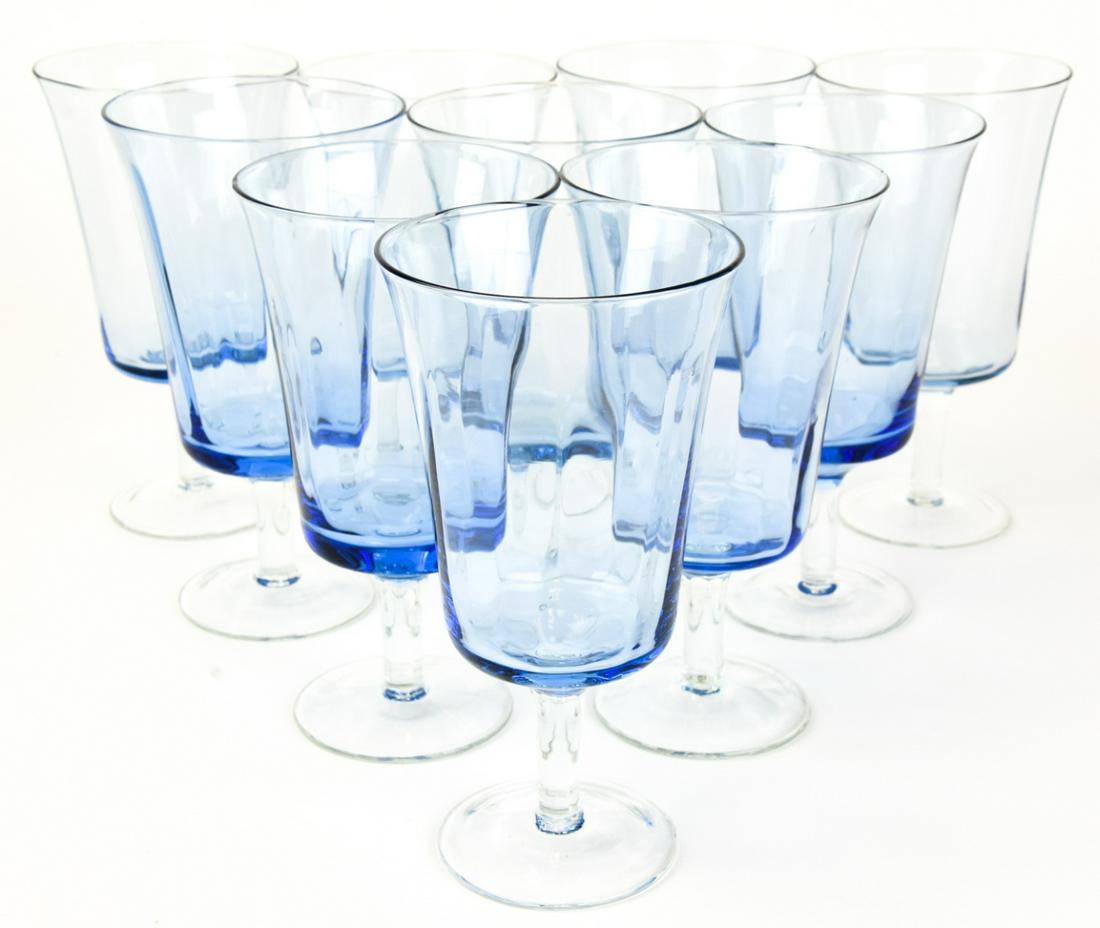 Set 10 Blue Art Glass Goblets: Set 10 Blue Art Glass Goblets. Goblets feature subtle faceted surface, flared lip, and beautiful gradient blue color. Measures 6.25 inches in height x 3.75 inches in diameter.