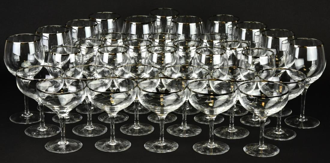 Collection Assorted Silver Rimmed Stemware: Collection of Assorted Silver Rimmed Stemware. Includes 13 champagne glasses, 11 large wine glasses, and 12 wine glasses. Largest glass measures 7 inches x 3 inches in diameter.