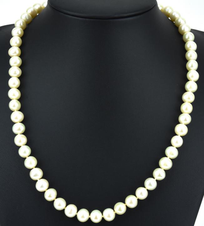 Estate 14 KT Gold & Cultured Pearl Necklace: Estate 14 KT Gold & Cultured Pearl Necklace. 14 KT yellow gold filigree clasp, hand knotted with baroque form approximately 5-6 mm cultured pearls. Measures 18 inches in length.