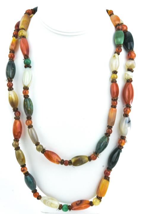 Vintage Handmade Carved Agate Bead Necklace: Vintage Handmade Carved Agate Bead Necklace. Including carved agate beads, Carnelian beads, moss agate beads. Measures 52 inches in length.