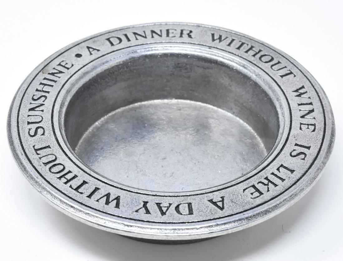 Contemporary Pewter Wine Coaster: Contemporary Pewter Wine Coaster. Pewter wine coaster that reads "A Dinner Without Wine is Like a Day Without Sunshine". Measures 1.5 inches x 6.5 inches.
