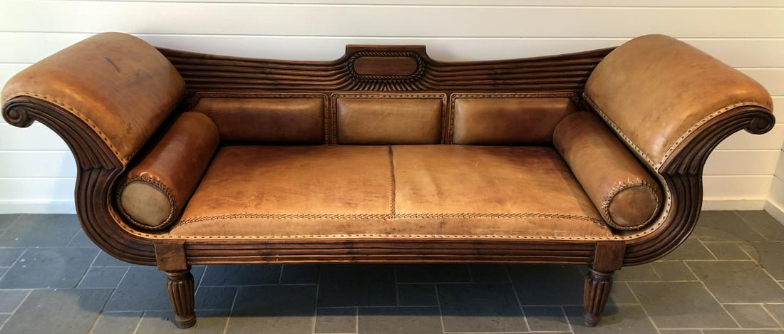 Leather sofa with carved wood trim deals