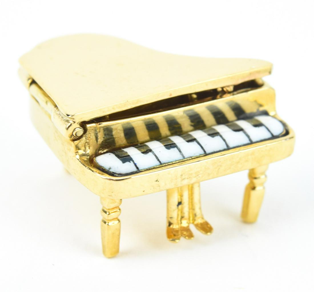 Vintage Tiffany & Co 14k Gold Enamel Piano Charm: Vintage Tiffany 14k Gold and Enamel Piano Charm – A spectacular miniature piano charm with moving parts and black and white enamel keys. Approximately 6.9 grams inclusive and .75 x .75 x.5 inche