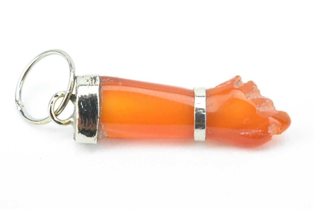 Hand Carved Carnelian Figa Pendant: Hand Carved Carnelian Figa Pendant. Measures 1.25 inches in length.
