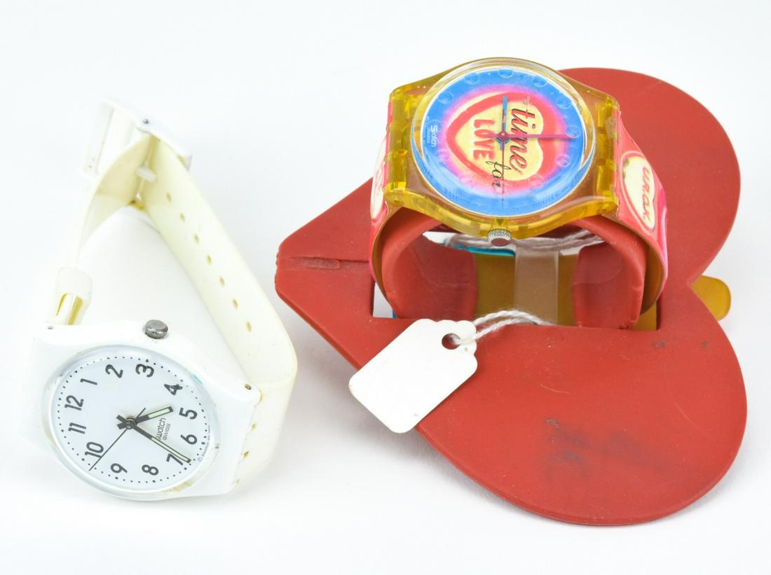 Pair of Vintage Swatch Watches: Pair of Vintage Swatch Watches – Lot includes authentic all white Swatch and Time for Love Swatch watch. Face is approximately 1.25 inch in diameter. Provenance: From a prominent Westchester Jew