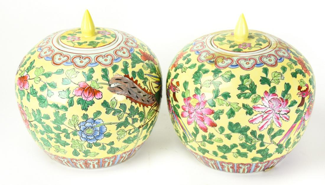 Pair Antique Chinese Export Porcelain Ginger Jar: Pair Antique Chinese Export Hand Painted Enamel Porcelain Ginger Jar. Depicts stylized birds and blooming flowers against a yellow ground. Mark on bottom. Measures 10.5 inches high x 9 inches wide