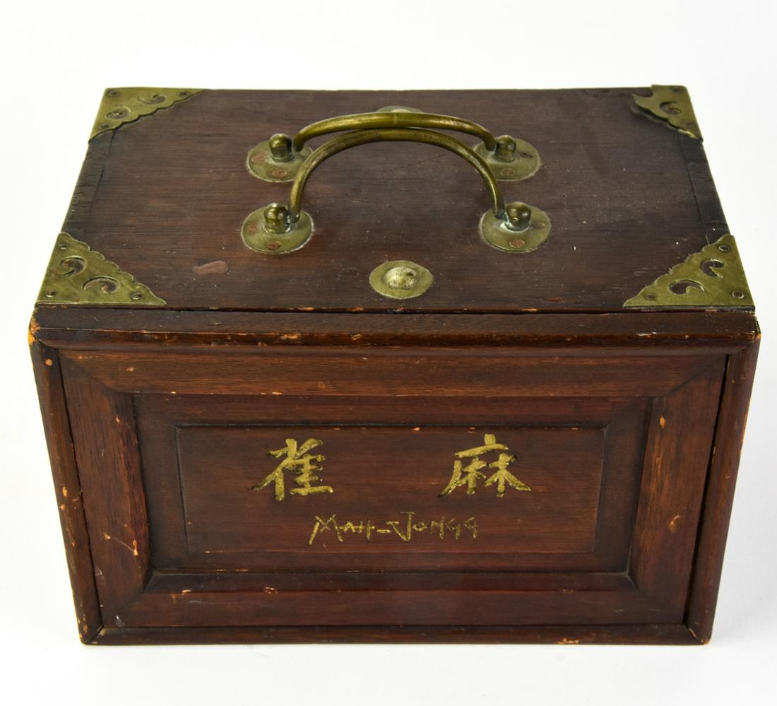 Antique Chinese Mahjong Set W Bone Carved Pieces: Antique Chinese Mahjong Set W Bone Carved Pieces. Box has brass details. Includes a complete set with four trays. Measures 6 inches in height by 9.5 inches in width by 7 inches in depth.