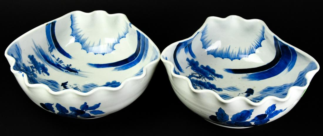 2 Asian Porcelain Seashell Shaped Bowls: 2 Asian Porcelain Seashell Shaped Bowls. Blue and white nature with figures scenes. Measures 4.5 inches in height by 10.25 inches in width by 10.5 inches in depth.