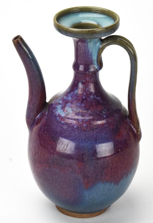 Chinese Flambe Pottery Teapot: Chinese Flambe Pottery Teapot. Blue and purple flambe glaze. Measures approximately 8.5 inches x 4.75 inches x 4 inches.