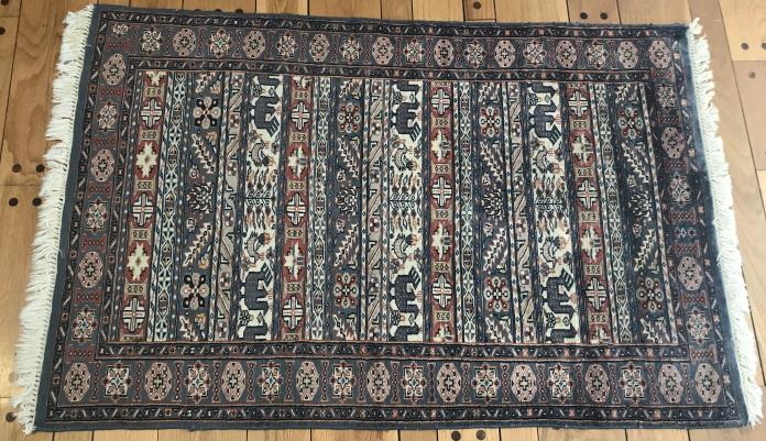 Hand Knotted Persian Throw Rug w Animal Motif: Hand Knotted Persian Throw Rug w Animal Motif & Fringe. Measures 37.5 x 57 inches.