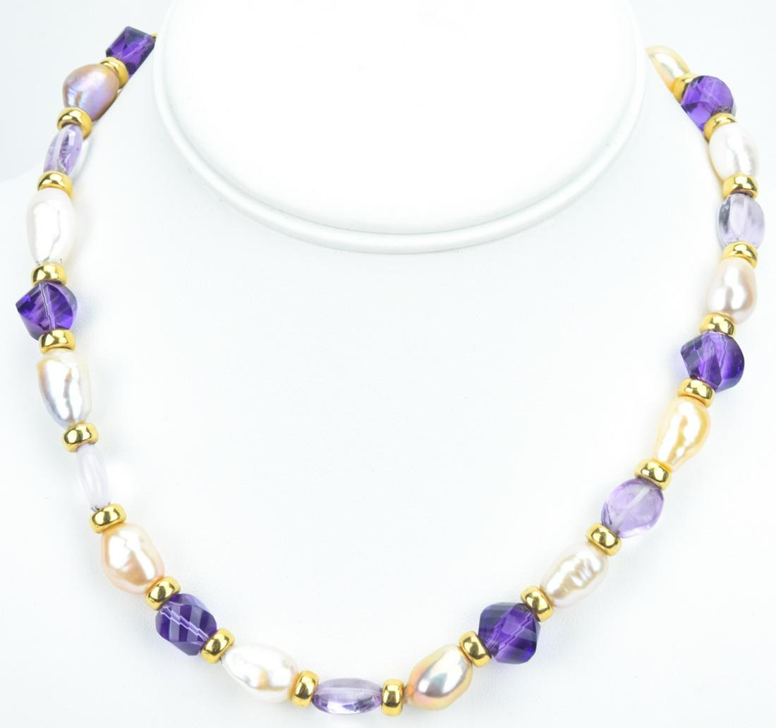 Baroque Pearl Amethyst & Art Glass Necklace: Baroque Pearl Amethyst & Art Glass Necklace. Set with fourteen (14) baroque pearls, amethyst beads and art glass beads. Gold plated filigree clasp and spacers. Measures 16.5 inches in length.