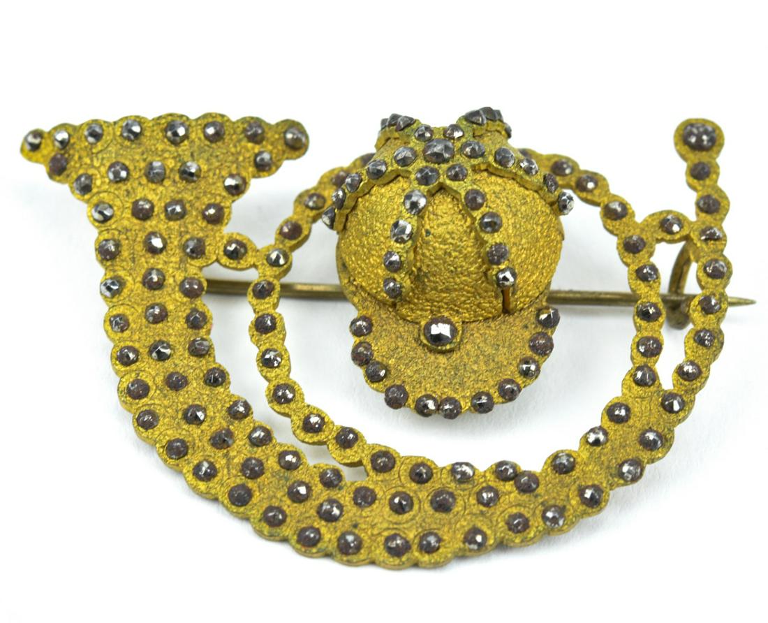 Antique 19th C Gilt & Cut Steel Equestrian Brooch: Antique 19th C Gilt & Cut Steel Equestrian Brooch. With a horn and riding hat. Measures just over 2 inches in width.