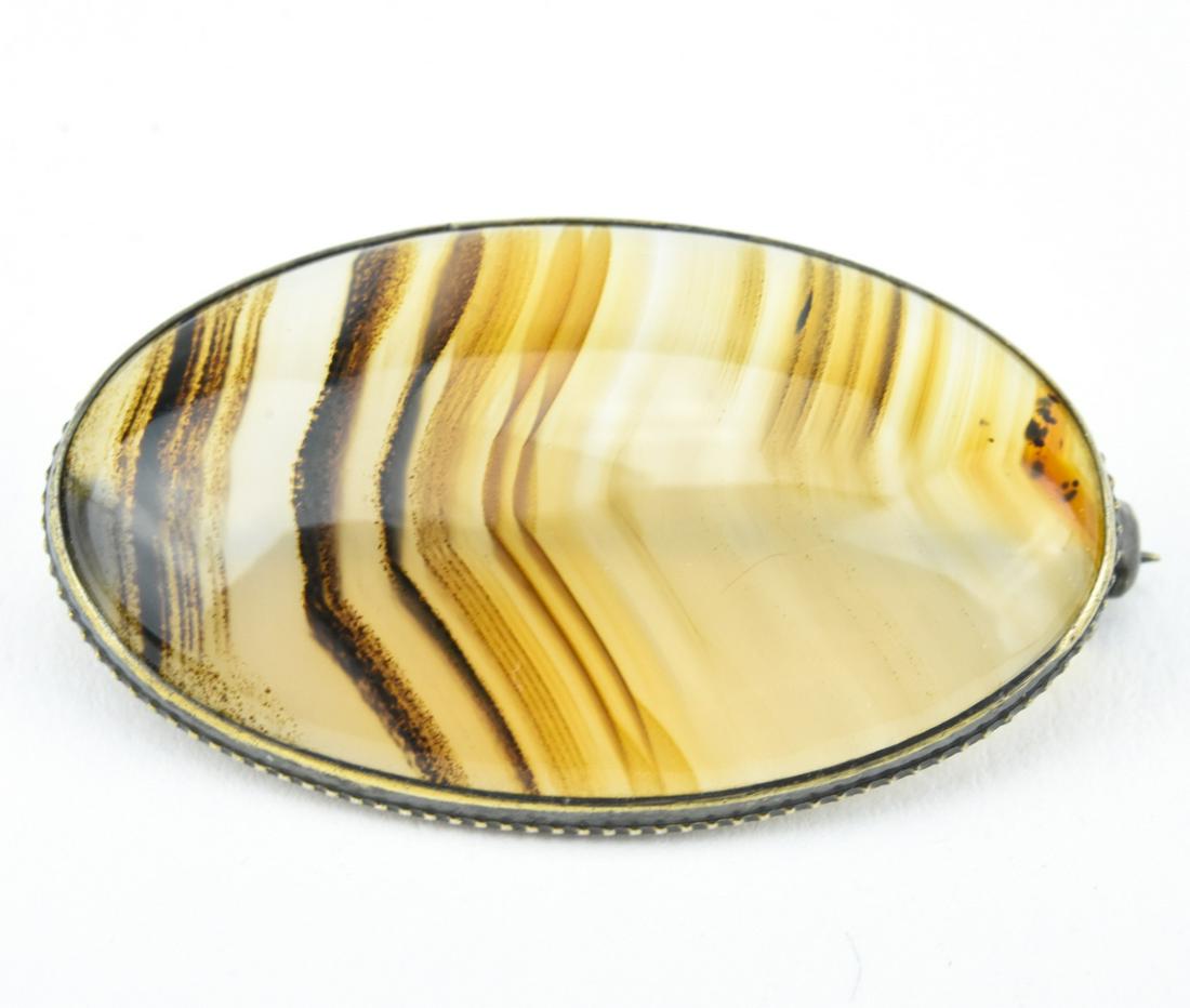 Antique 19th C Specimen Agate Cabachon Brooch: Antique 19th C Specimen Agate Cabachon Brooch. Quality example of banded agate. Measures 1.5 inches in length.