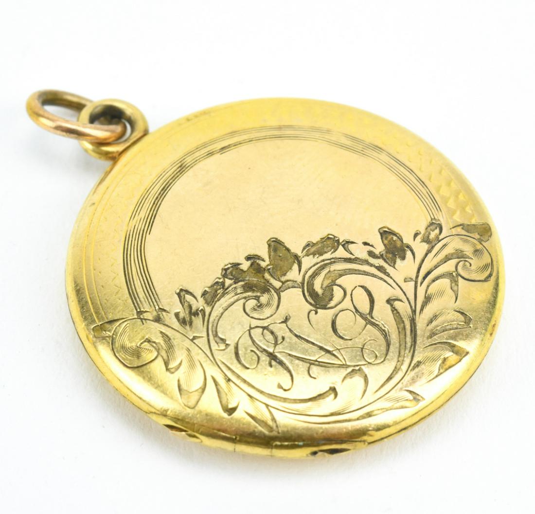 Antique Chased Engraved Gold Filled Locket: Antique Chased Engraved Gold Filled Locket. Made by Simmons. Measures just over 1.5 inches in length.