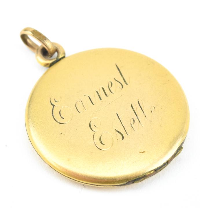 Antique 19th C Gold Locket w Inscription: Antique 19th C Gold Locket w Inscription. Gold filled or gold topped locket necklace pendant inscribed "Earnest & Estelle." Measures 1.5 inches in length.