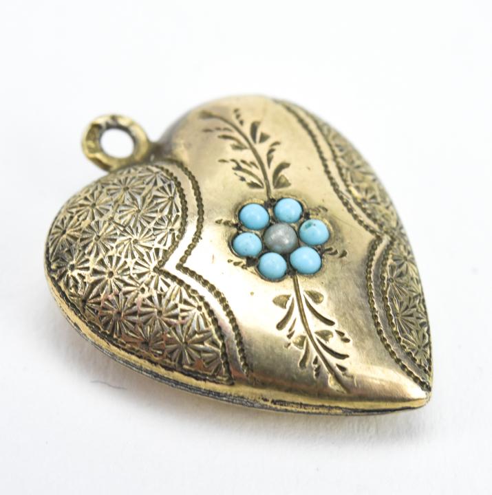Antique 19th C Heart Form Necklace Pendant: Antique 19th C Heart Form Necklace Pendant. Hand chased design on front. Measures just under 1 inch in length.