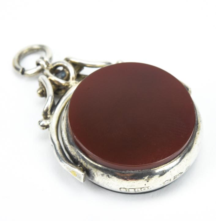Antique English Sterling Spinning Watch Fob: Antique English Sterling Spinning Watch Fob. Sterling silver frame with bloodstone and carnelian panels, having full English hallmarks. Measures just over 1.5 inches in length.