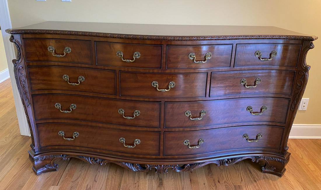 Louis XIV Carved Mahogany Serpentine Bureau: Louis XIV Carved Mahogany Serpentine Bureau. Having 11 drawers, brass hardware, and a carved foliate design on apron and sides. Measures 39 inches high x 72.5 inches wide x 22 inches deep.