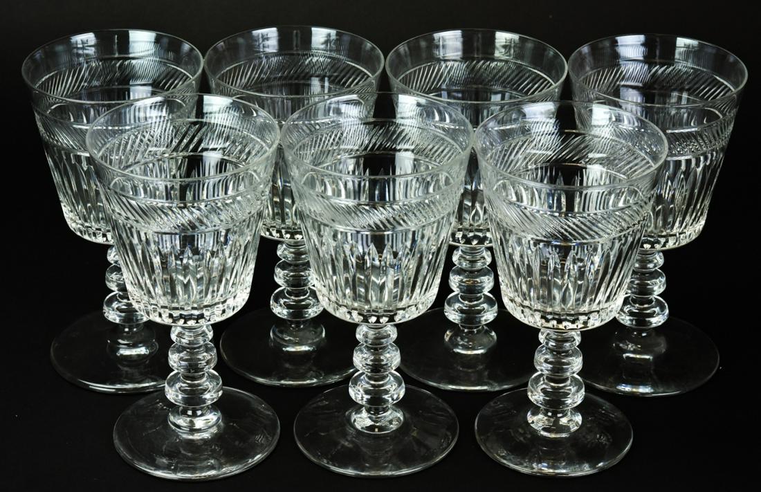 Antique Set Of Cut Crystal Wine Goblets: Antique Set Of Cut Crystal Wine Goblets. Lot includes seven faceted crystal wine goblets with ornately shaped stems. Each measures approximately 6.25 inches in height. This sale is online only - no pu