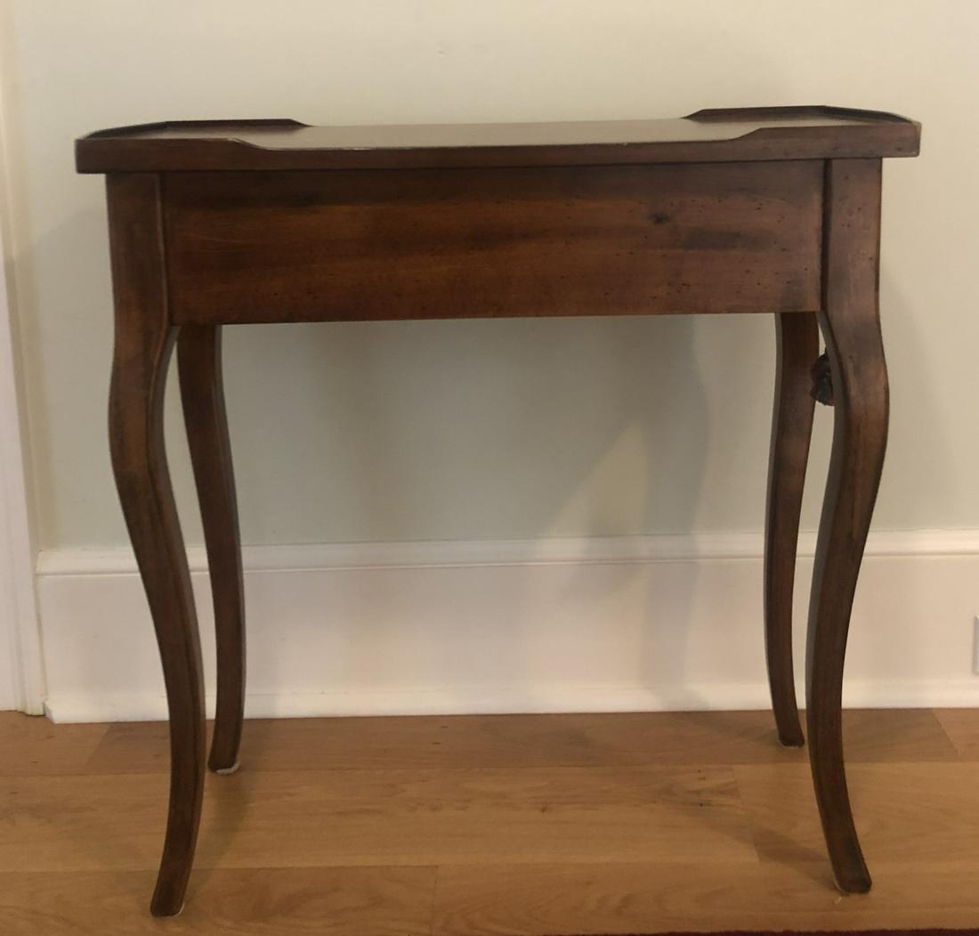 Side Table W Cabriole Legs: Side Table with Cabriole Legs. Features carved gallery detail and a single drawer. Measures 27.25 inches x 28.5 inches x 10.75 inches. This sale is online only - no public preview or live in house sal