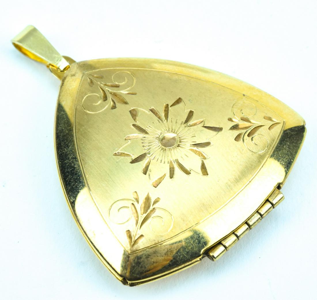 Vintage Gold Filled Scrollwork Locket: Vintage Gold Filled Scrollwork Locket. Measures 2 inches in length.