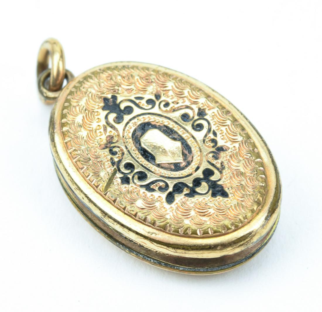 Antique 19th C Yellow Gold Locket Pendant: Antique 19th C Yellow Gold Locket Pendant. Front is decorated with black enamel, front and back feature hand engraved scrollwork designs. Panels test as 10kt yellow gold, frame is gold-filled. Measure