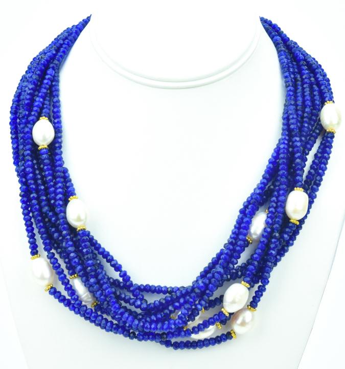 Blue Sapphire & Baroque Pearl Necklace: Blue Sapphire & Baroque Pearl Necklace. Ten strands of faceted blue sapphire beads in varying tones set with 11 baroque pearls with gold plated clasp. Strands are hand knotted. Beads test as sapphire