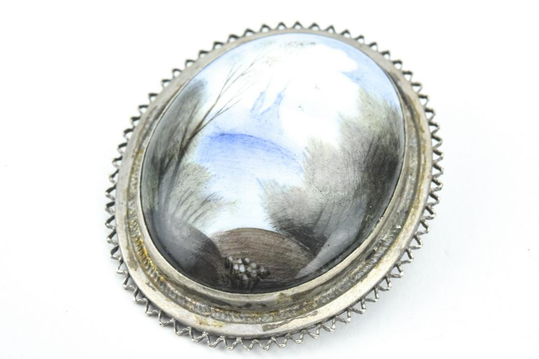 Antique Swiss Enamel & Silver Brooch: Antique Swiss Enamel & Silver Brooch. Hand painted landscape scene in enamel with sterling silver frame. Measures 1.5 inches in length.