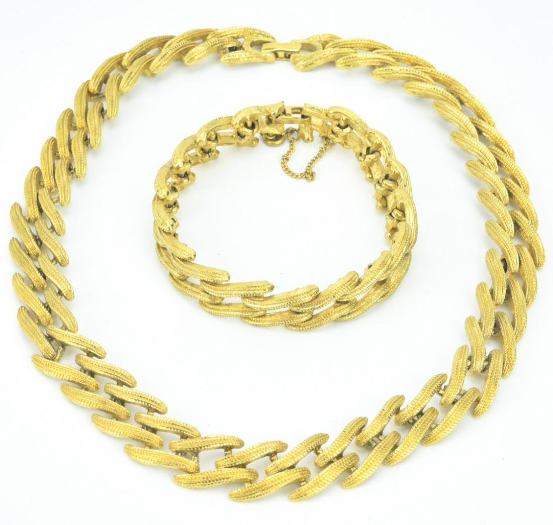 Vintage Gilt Metal Necklace & Bracelet Set: Vintage Gilt Metal Necklace & Bracelet Set. Made by Monet. Articulated gilt metal panel design. Necklace measures 16 inches in length.