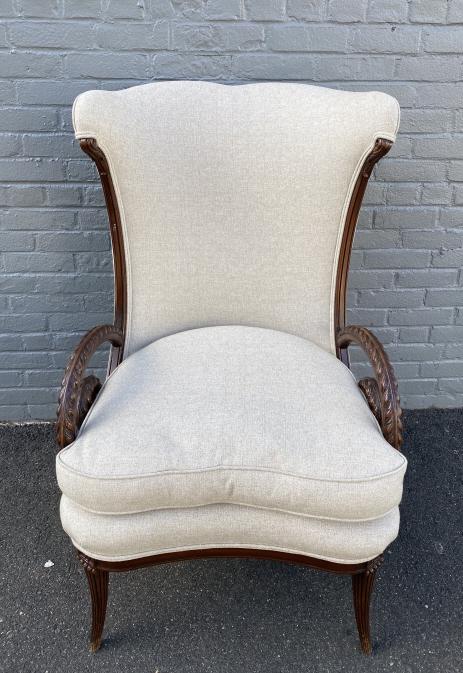 Louis XVI Style Bergere Chair w Carved Horn Motif: Louis XVI Style Bergere Chair w Carved Ram Horn Motif Armrests. Also features reeded legs with carved floral medallion. Measures 42.75 inches high x 27 inches wide x 30 inches deep x 21 inches from fl