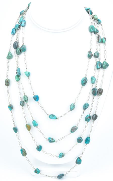 Sterling Silver & Turquoise By The Yard Necklace: Sterling Silver & Turquoise By The Yard Necklace. Textured sterling silver link with tumbled turquoise beads. Measures an impressive 100 inches in length.