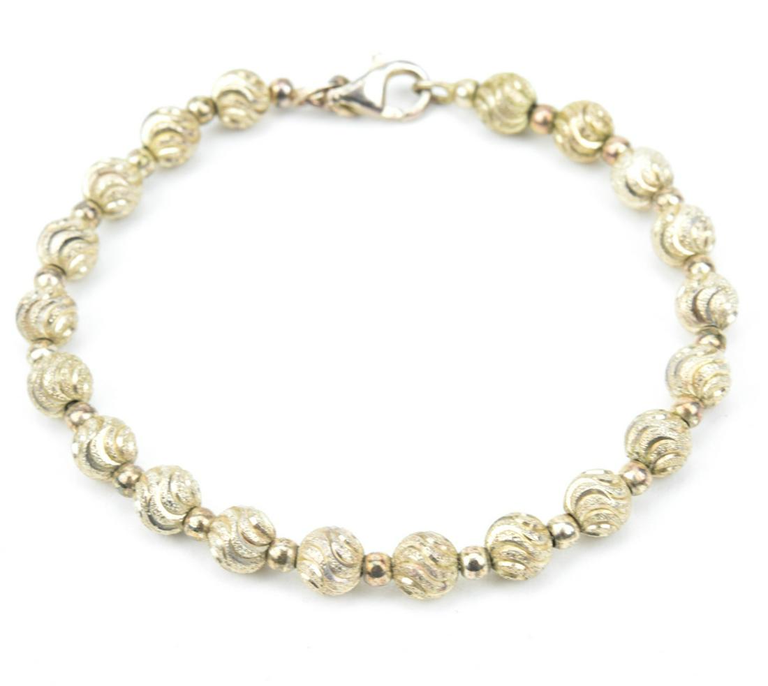 Italian Sterling Silver Beaded Bracelet: Italian Sterling Silver Beaded Bracelet. Measures 7.5 inches in length.